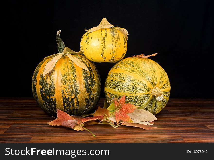 Pumpkins in black, autumn background