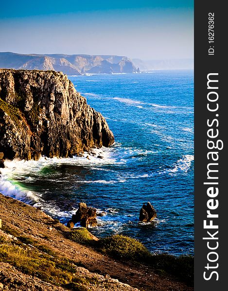 Colourful coastline view from cliff side with blue sea and sky. Colourful coastline view from cliff side with blue sea and sky