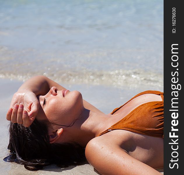 Happy woman relaxing in the water in a sea. Happy woman relaxing in the water in a sea