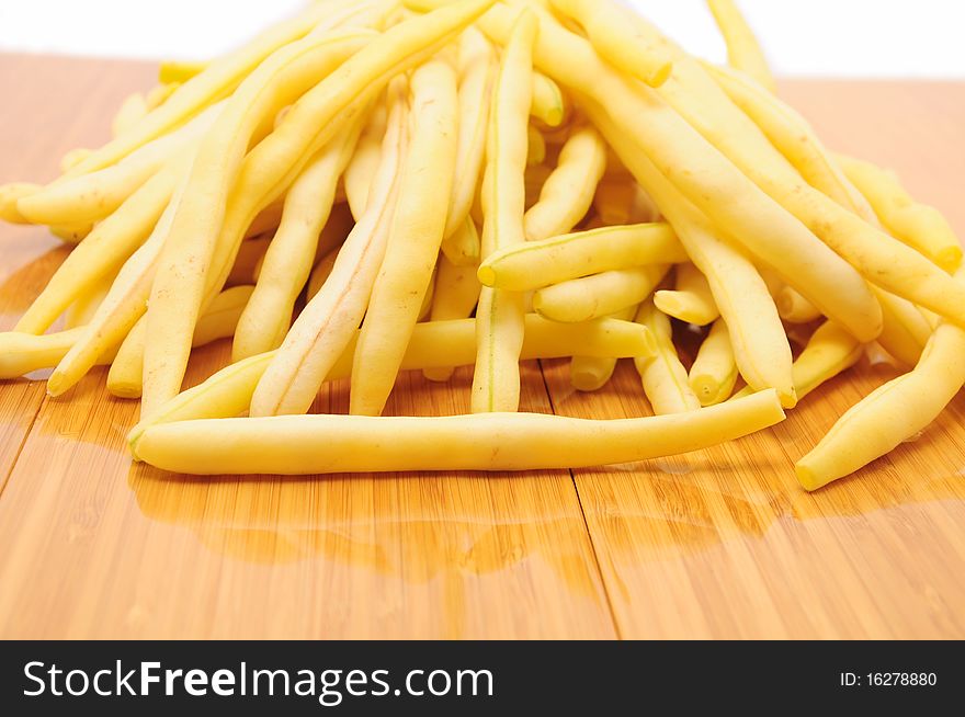 Yellow beans on wooden table. Yellow beans on wooden table