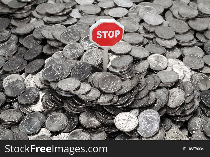 Heap Of Coins And Sign Stop