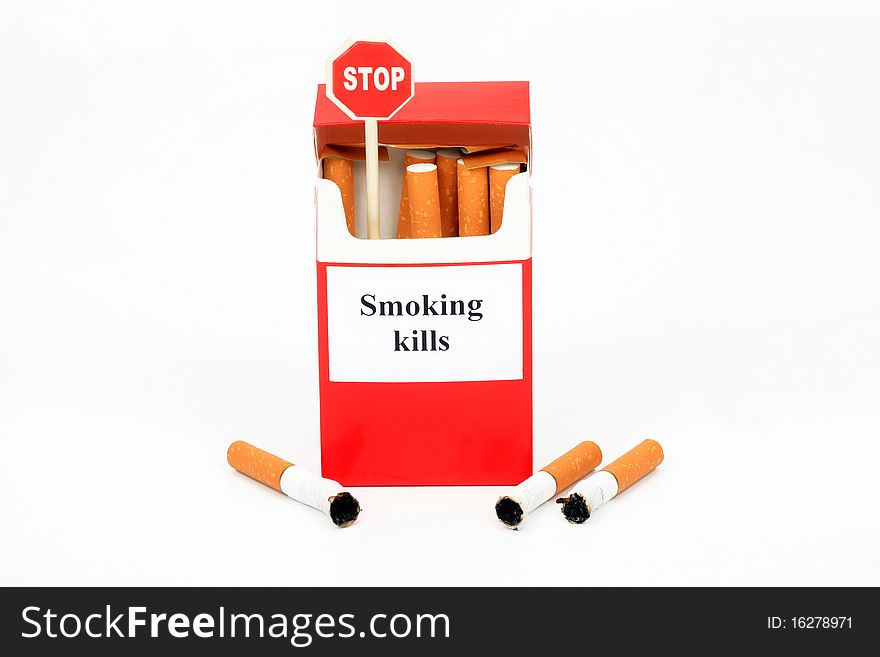 Pack of cigarets, butts and sign Stop on a white background
