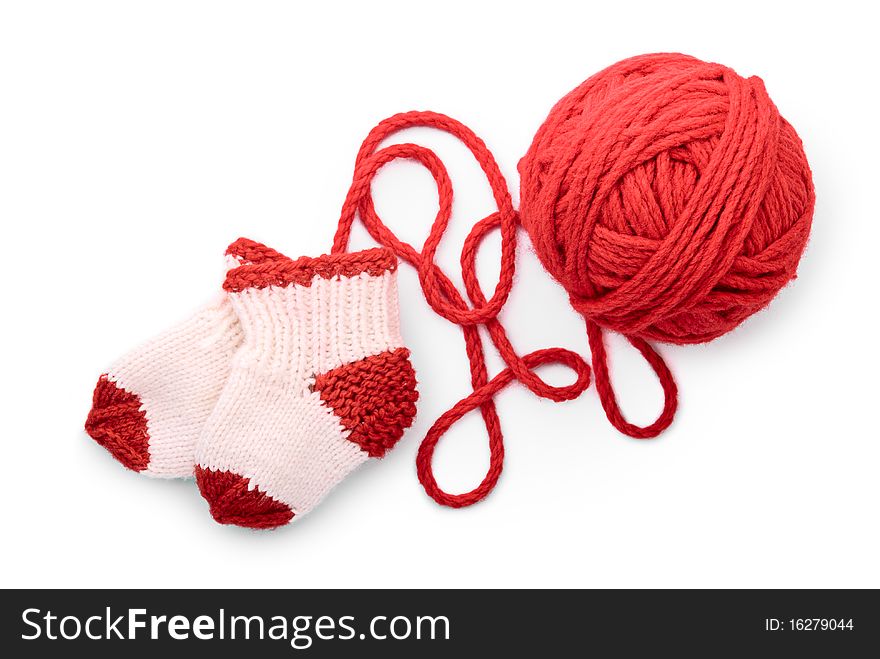 Isolated red skein and knitted socks