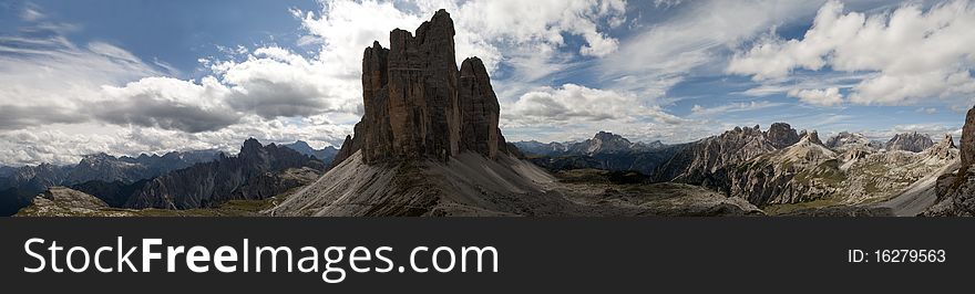 Mountain panorama in background and three summits in foreground 3 tre cime lavaredo drei zinnen. Mountain panorama in background and three summits in foreground 3 tre cime lavaredo drei zinnen