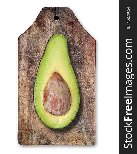 Avocado cut on wooden table, clipping path. Avocado cut on wooden table, clipping path.