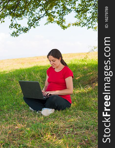 Woman Outdoor Using Laptop Sitting On Grass