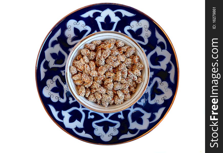 Oriental Sweets - peanuts with sesame on a plate Uzbek