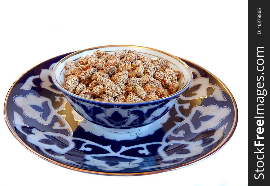 Oriental Sweets - peanuts with sesame on a plate Uzbek