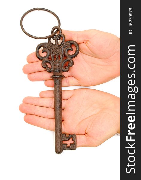 Old Key In Palm Of Hand