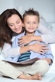 Mother And Child Reading Book At Home Royalty Free Stock Photo