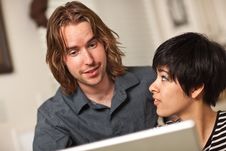 Happy Young Man And Woman Using Laptop Together Stock Photos Happy Young Man And Woman Using Laptop Together Stock Photos