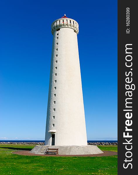 Poroddsstadir lighthouse in the background of blue sky