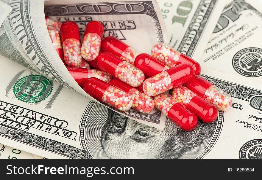 Money and red tablets closeup. Money and red tablets closeup