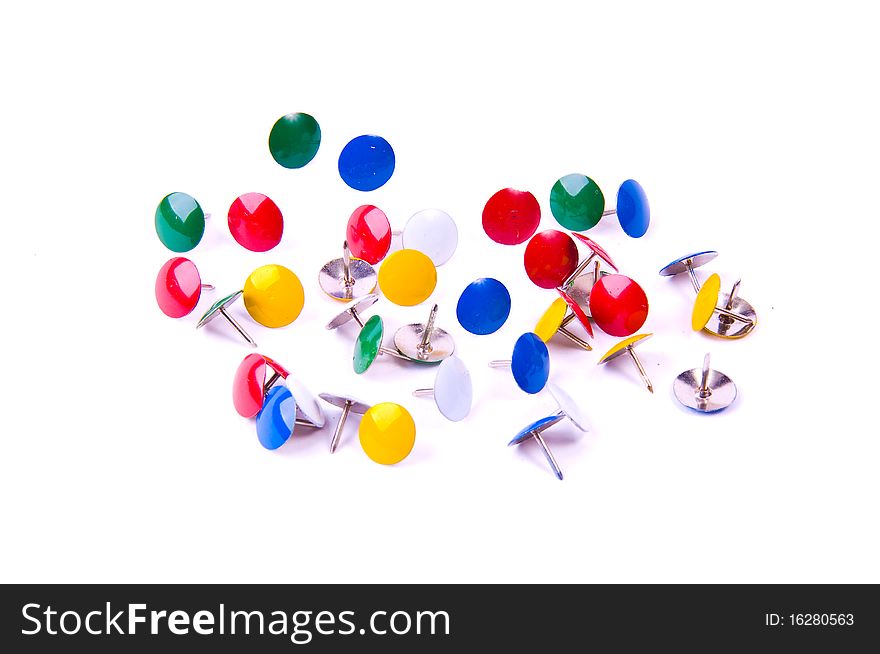 Circle of colourful office pins on white background. Circle of colourful office pins on white background