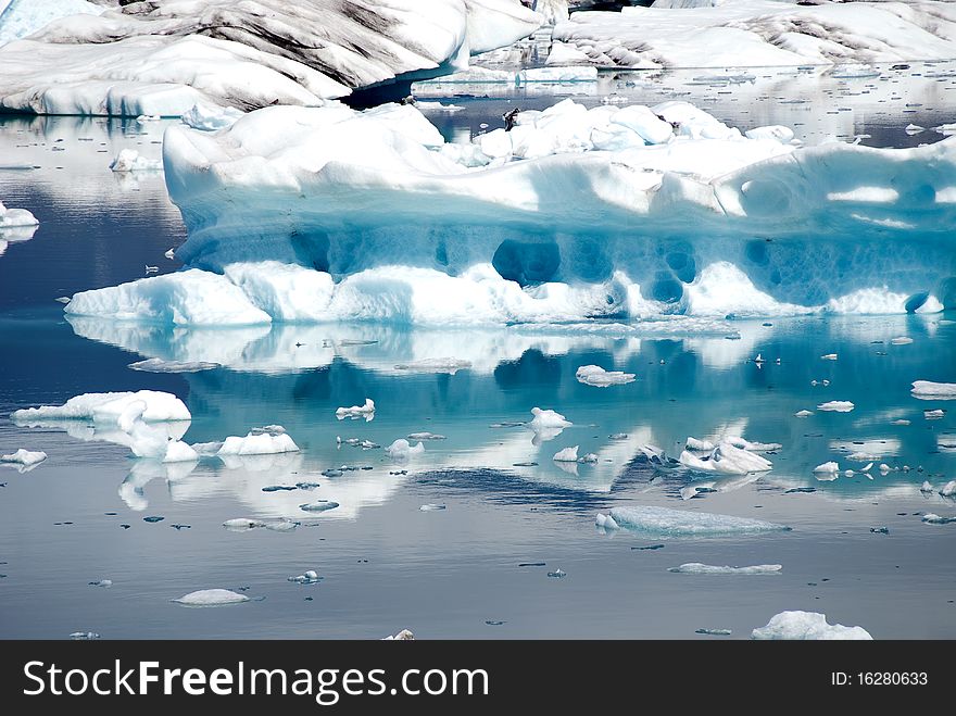 Icegerg reflections on the lake Jokulsarlon in Iceland. Icegerg reflections on the lake Jokulsarlon in Iceland