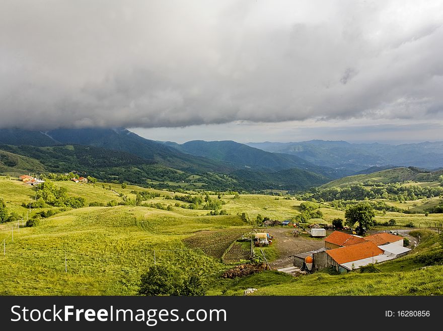 Some farms in italian countryside undere stormy clouds. Some farms in italian countryside undere stormy clouds