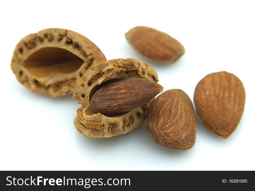 Almonds group on a white background close up