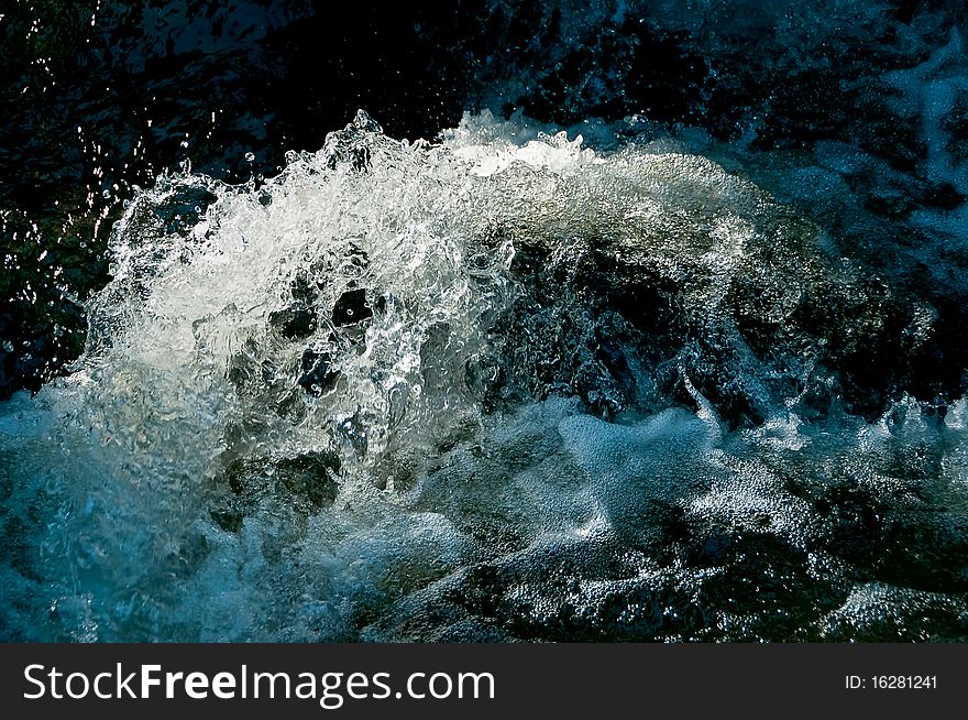 Water of a brook. By the short shutterspeed, the water seems to be frozen