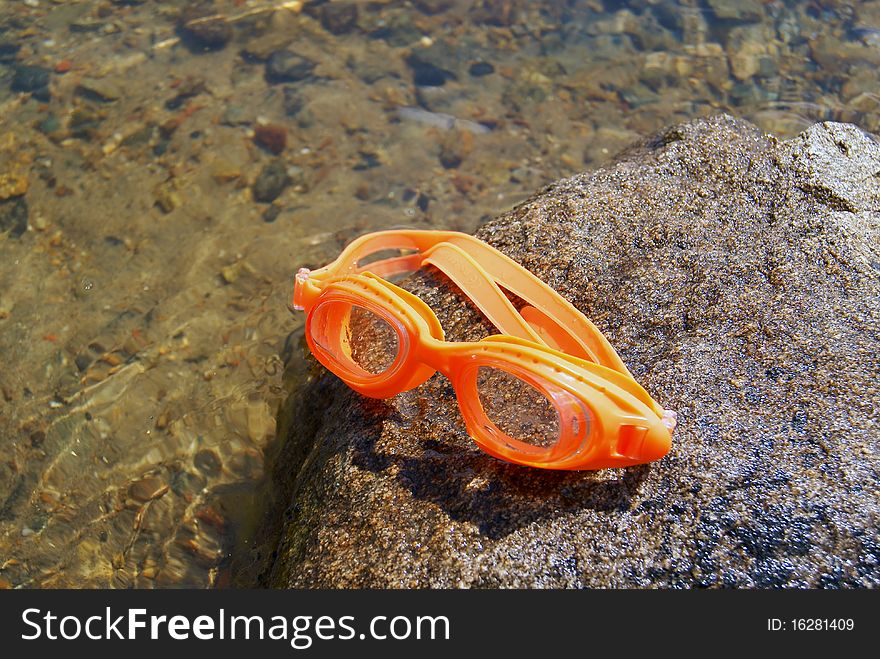 Glasses For Swimming On A Stone