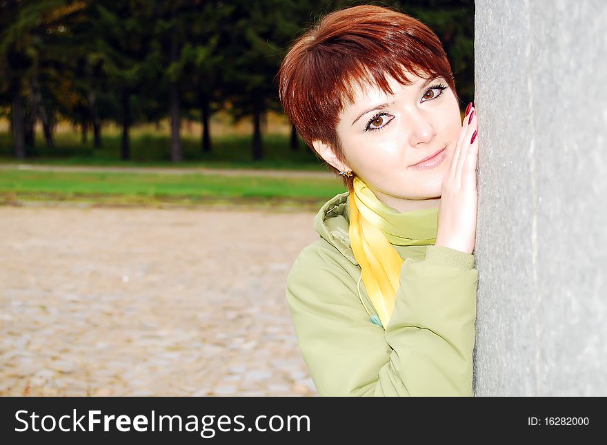 Pretty woman in the autumn park.