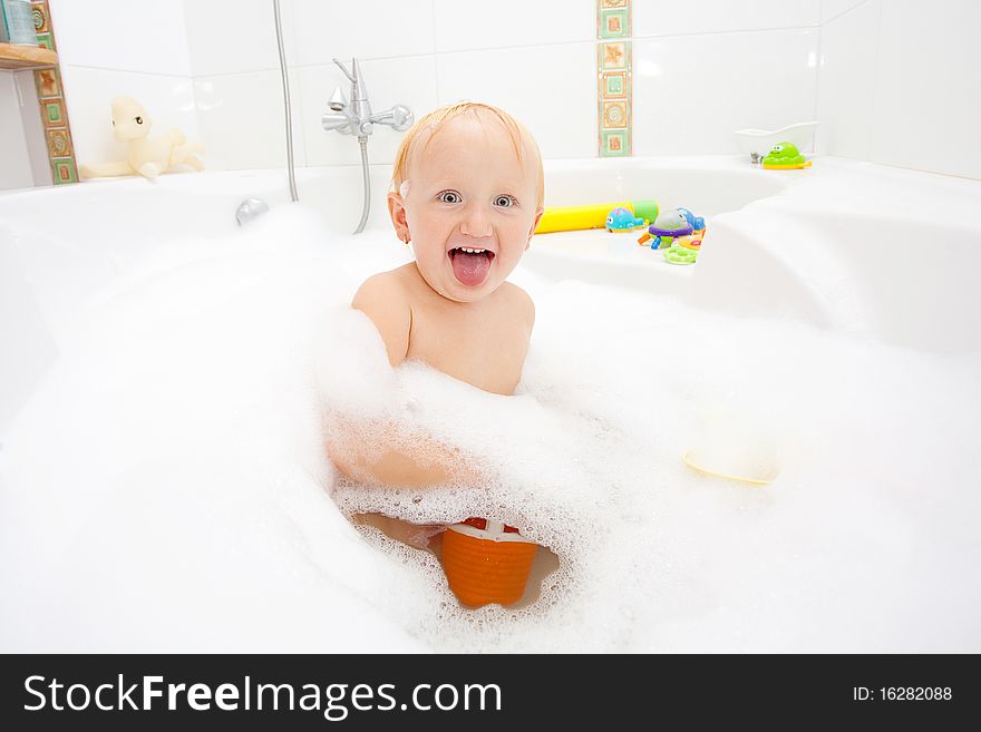 A baby girl in a bathtub