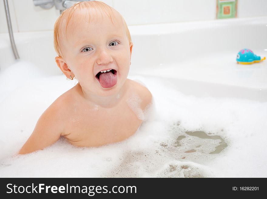 A baby girl in a bathtub