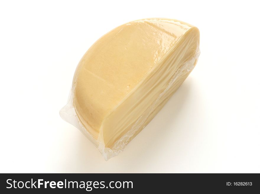 Half of round cheese in plastic