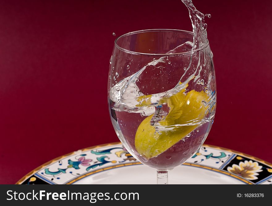 Apple Slice Dropped in Glass of Water. Apple Slice Dropped in Glass of Water