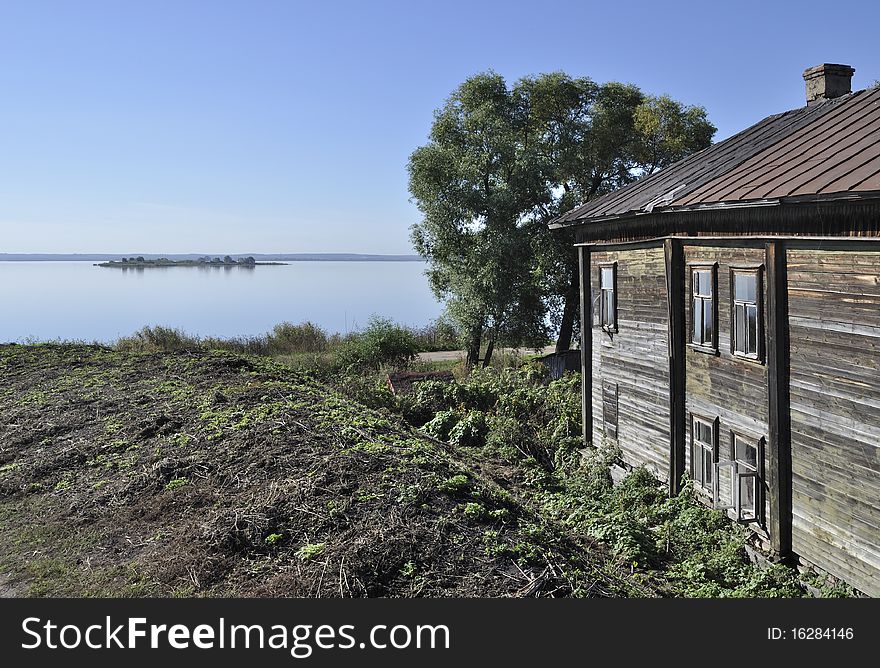 View of lake Nero and old wooden house in ancient russian town Rostov The Great. View of lake Nero and old wooden house in ancient russian town Rostov The Great