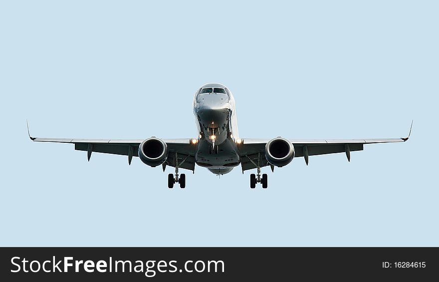 Landing airliner isolated on blue background