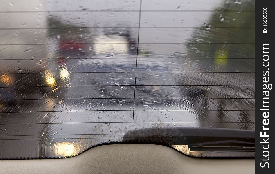 Kind on highway through wet glass. Kind on highway through wet glass