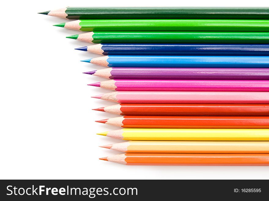 Row of bright colored pencils on white background. Row of bright colored pencils on white background