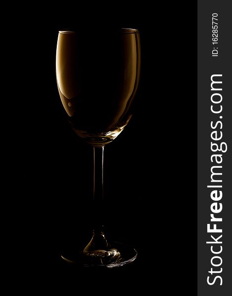 Empty wine glass on black background