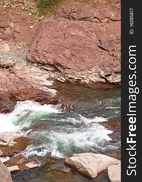 A white stream between rocks