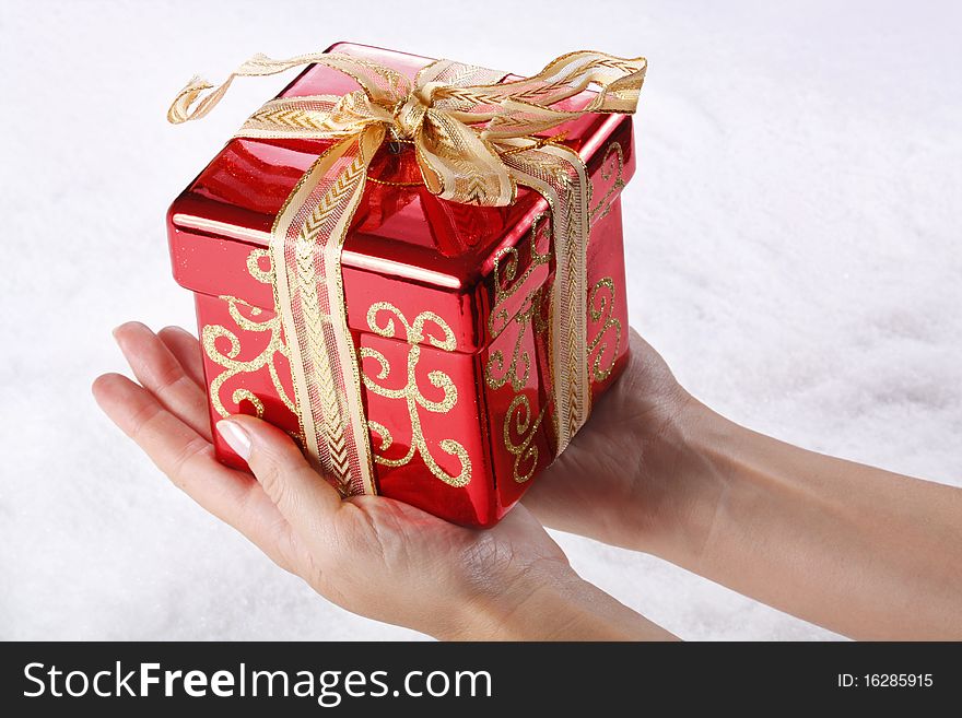 Image of small red box placed on human palm. Image of small red box placed on human palm