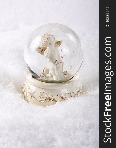 Image of angel in glass sphere