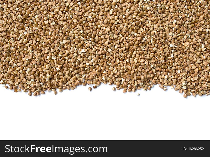 Scattering of a buckwheat isolated over white background