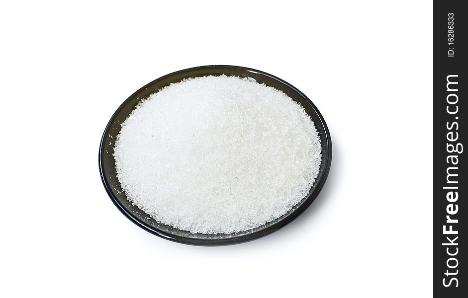 Black Plate With White Sugar Isolated On White
