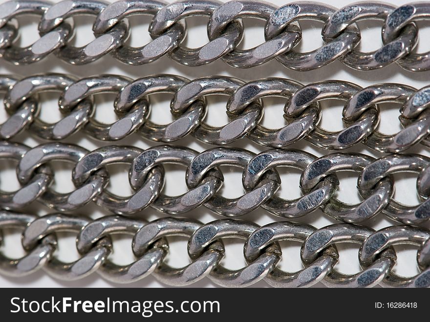 Four similar matalic chains background. Four similar matalic chains background