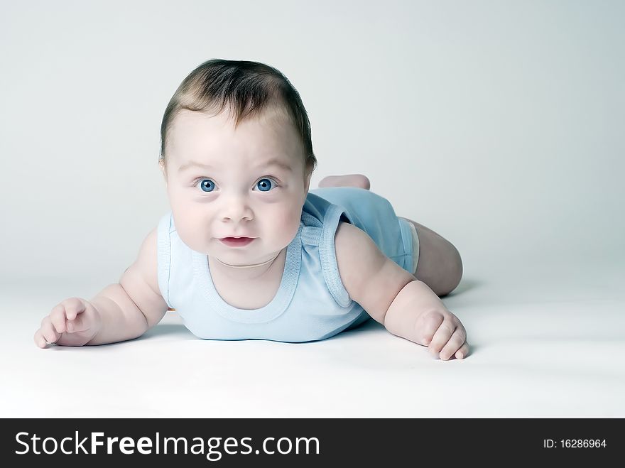 Happy baby crawl on a white background