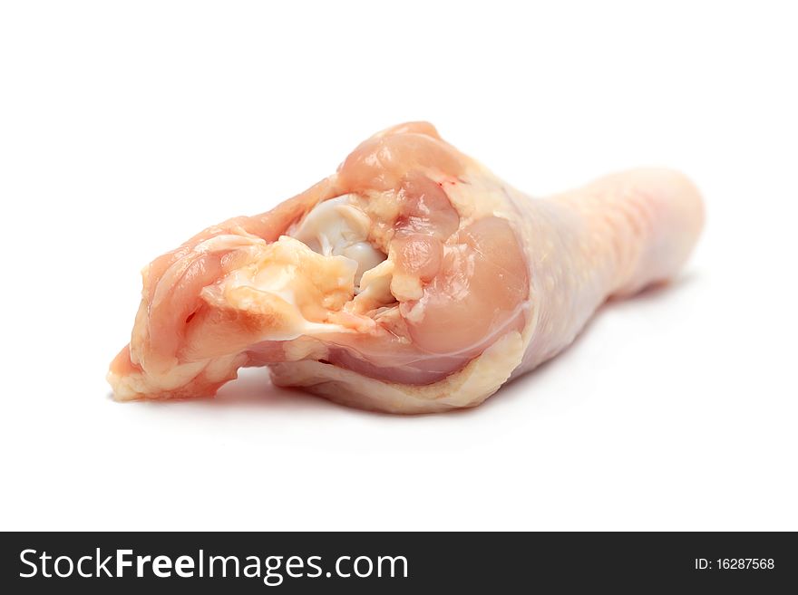 Close up of a raw chicken drumsticks isolated on white background.