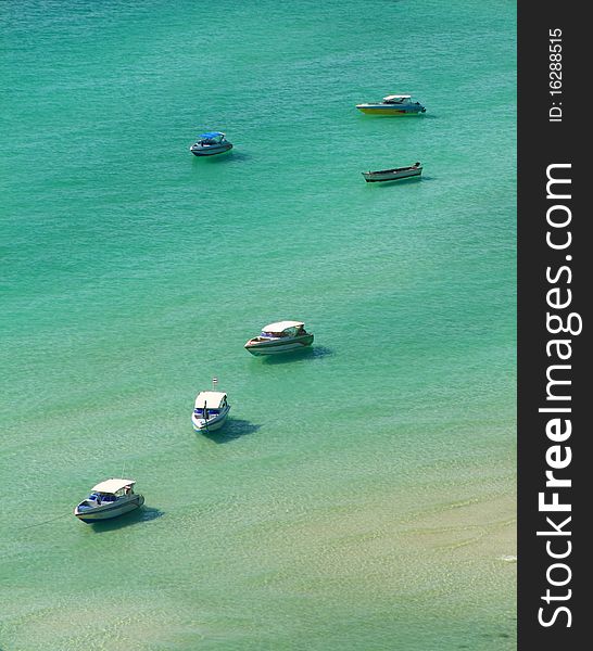 Boat parked in crystal clear waters. Boat parked in crystal clear waters.