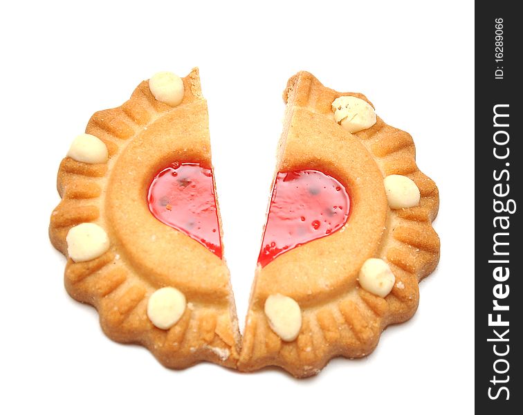 Broken biscuits in half a heart on white