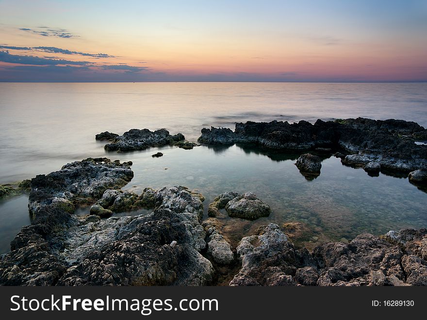 Seascape. Sunset and rocks. Nature composition.