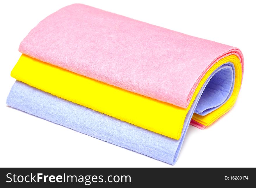 Pile of various multicolor microfibre cloths on white. Pile of various multicolor microfibre cloths on white