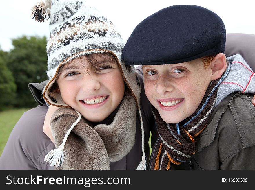 Brother and sister wearing hat in winter. Brother and sister wearing hat in winter