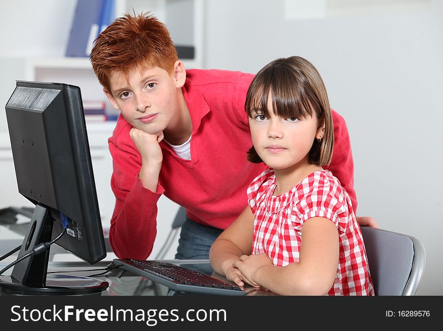Children sitting in classroom in front of computer. Children sitting in classroom in front of computer