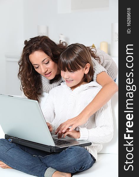 Woman And Girl In Front Of Computer