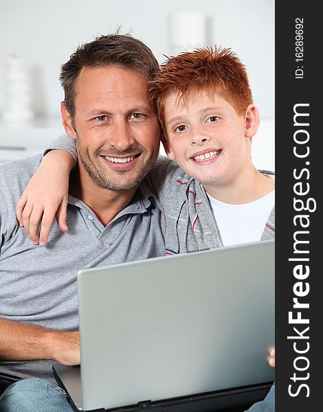 Father And Son Connected On Internet