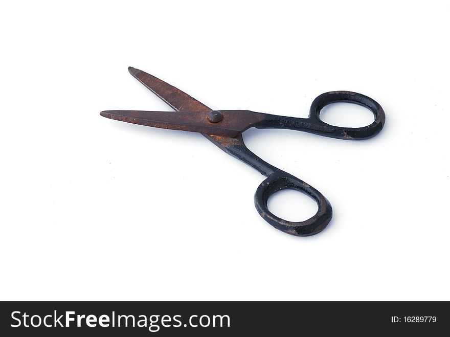 Old iron scissors on white background